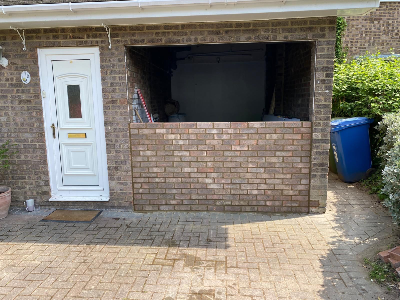Garage opening bricked up with new windows in progress — Crowthorne Construction