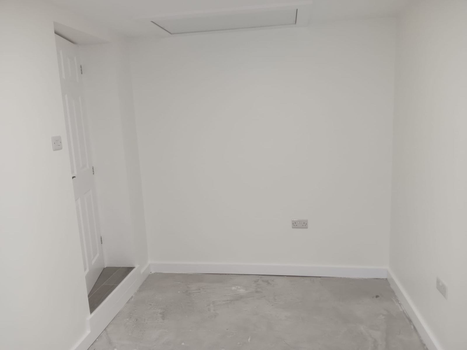 Finished plastered room after garage conversion — Crowthorne Construction