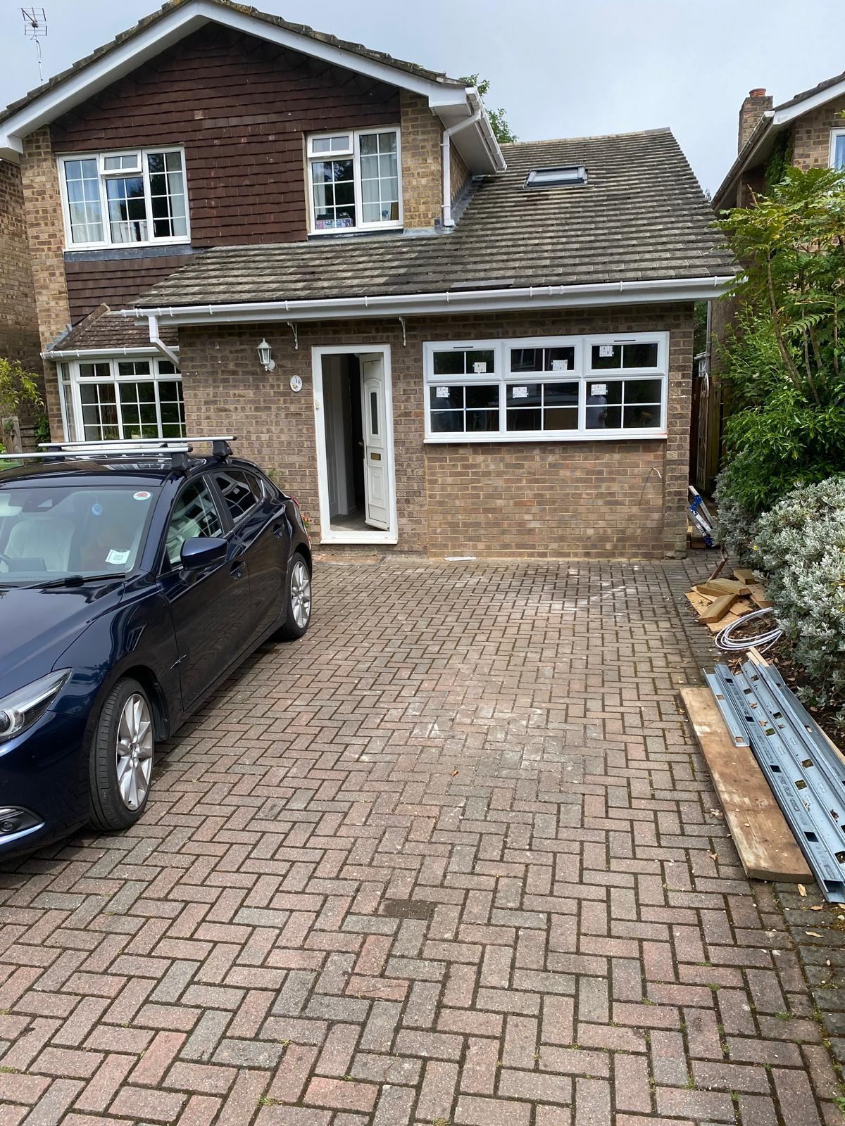 Completed garage conversion exterior with new windows and brickwork — Crowthorne Construction, Berkshire