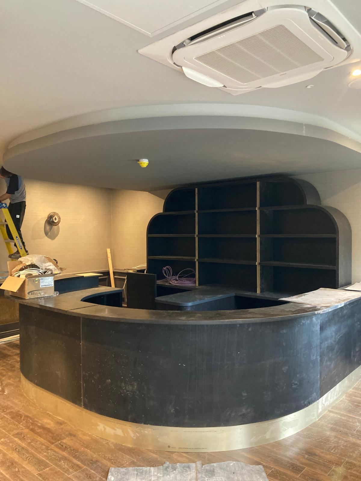 Hotel bar structure and shelving under construction — Crowthorne Construction